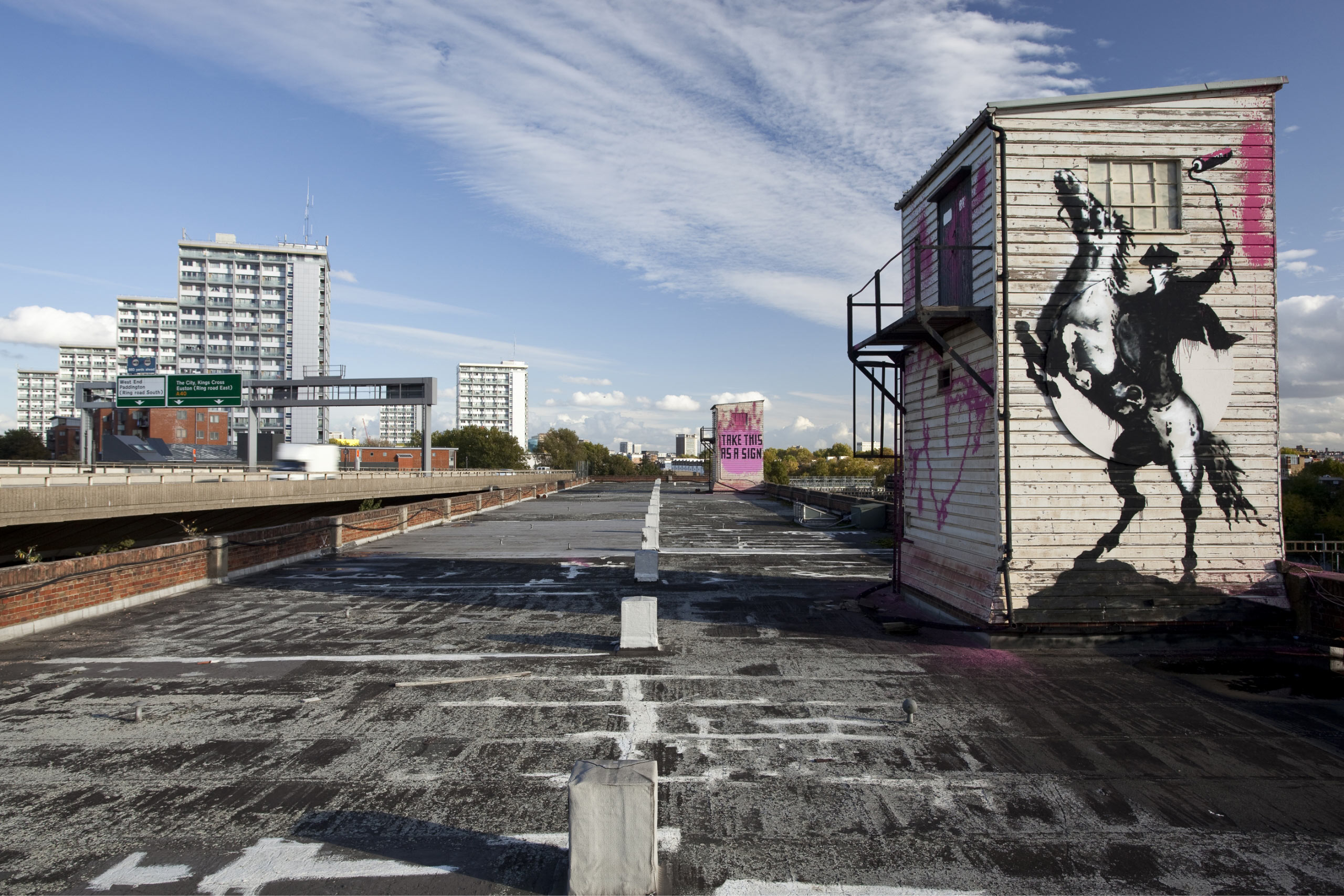 Image of Banksy's 'Highwayman' and 'Sign' at Great Western Studios, London